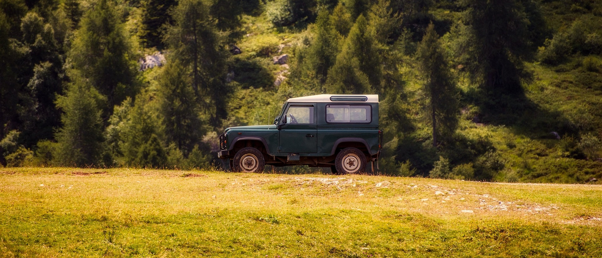 Landrover Driving in Field