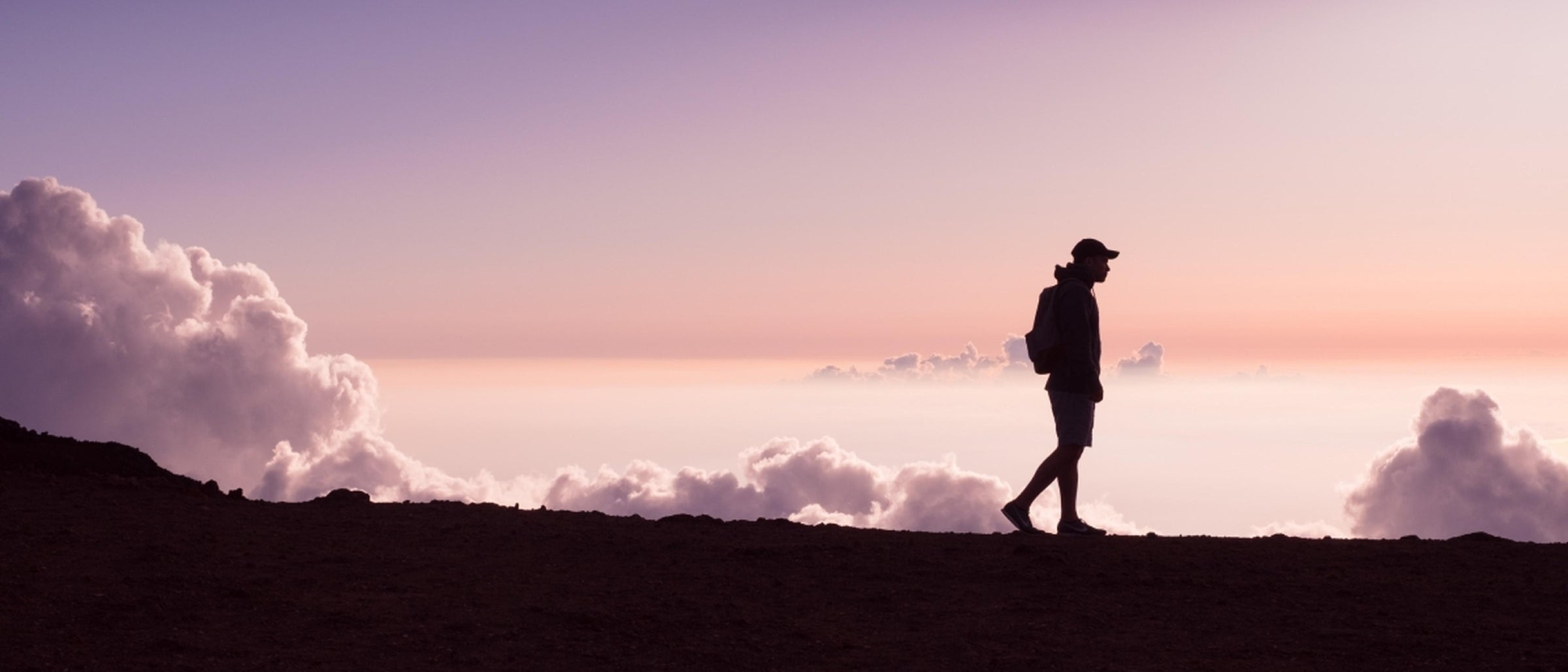 Walker Silhouetted against Skyline